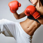 beautiful woman with the red boxing gloves, studio shot